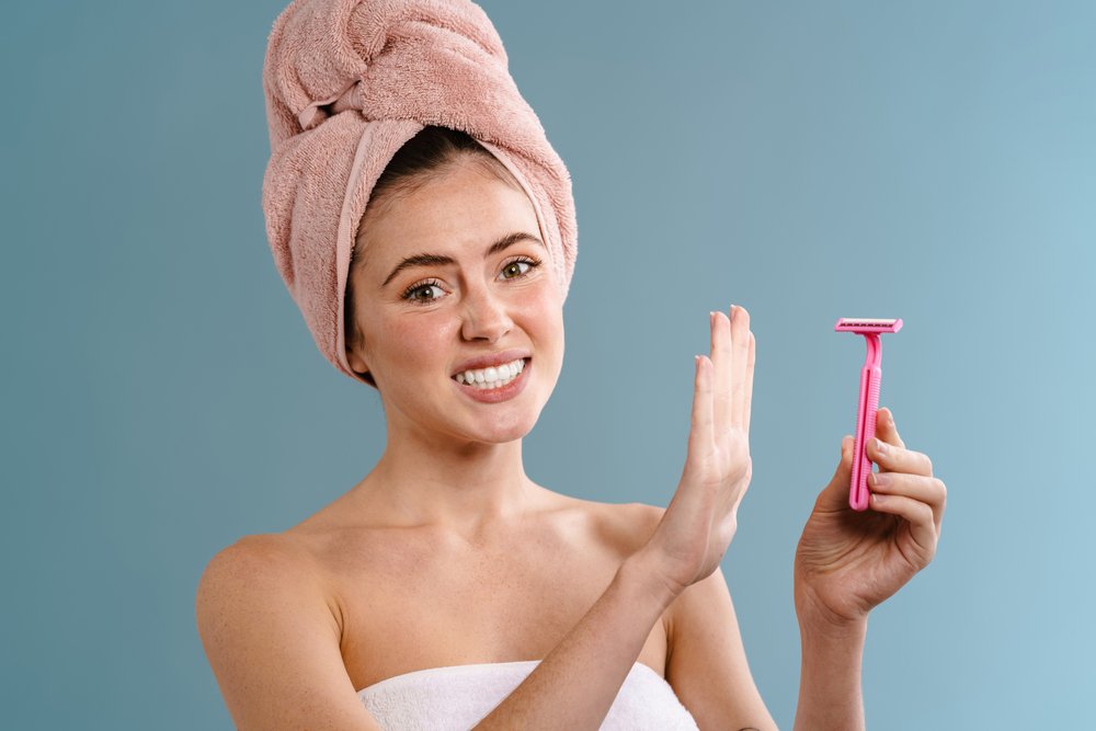 Image,Of,A,Young,Displeased,Woman,In,Towel,Holding,Blade